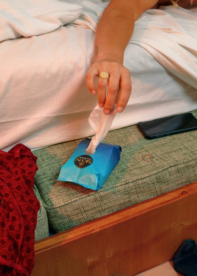 Gril hand reaching over SKYN Get Fresh wipes Gril hand reaching over SKYN Get Fresh wipes